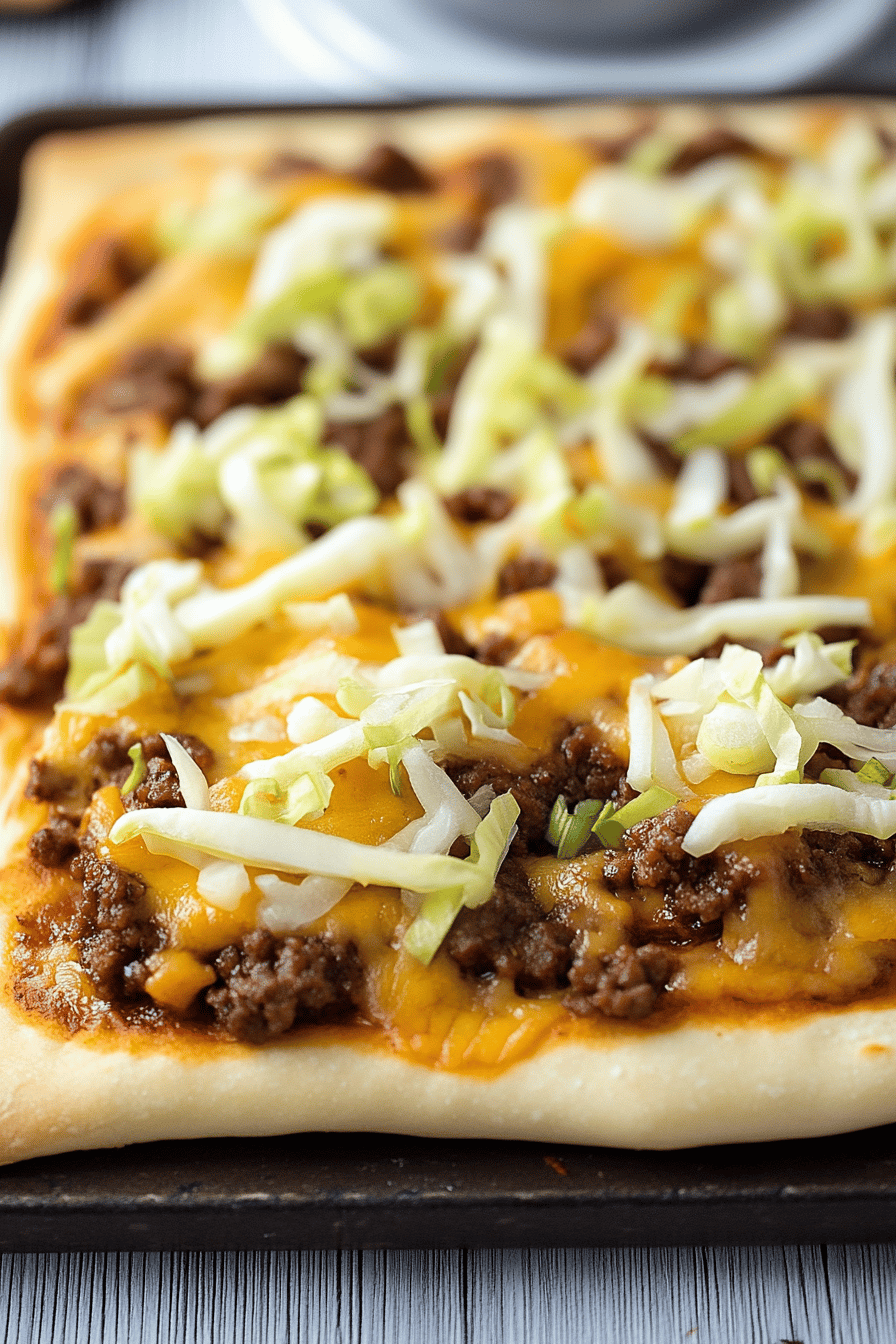 Big Mac Pizza slice on plate showing perfect texture and swirl pattern