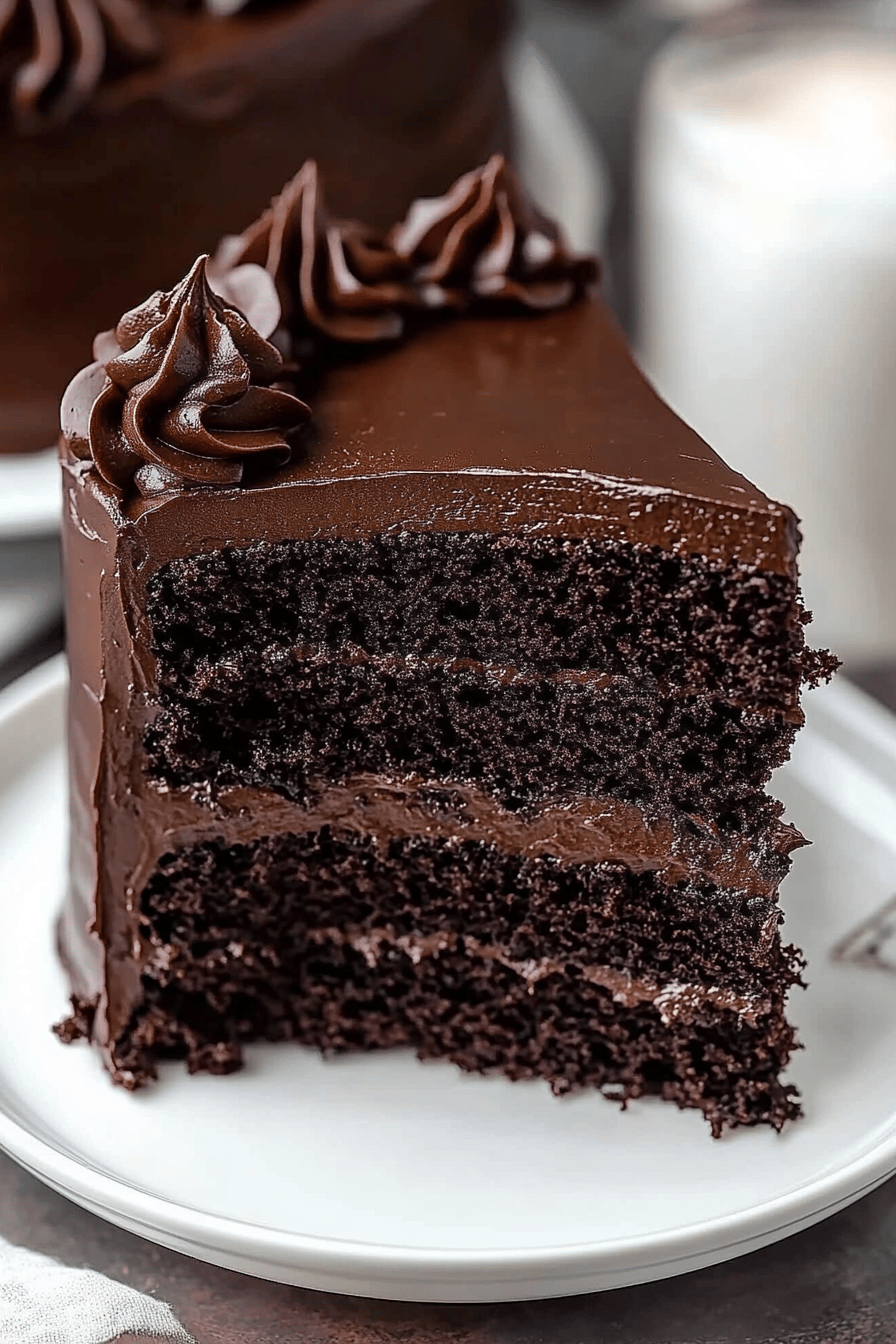 Black Velvet Cake Recipe slice on plate showing perfect texture and swirl pattern