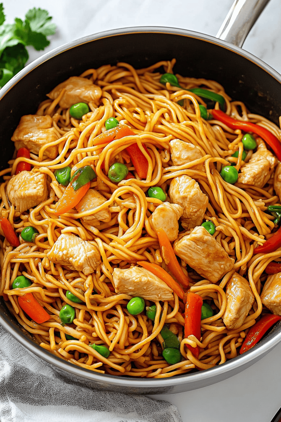 Chicken Lo Mein Recipe ingredients organized and measured on kitchen counter