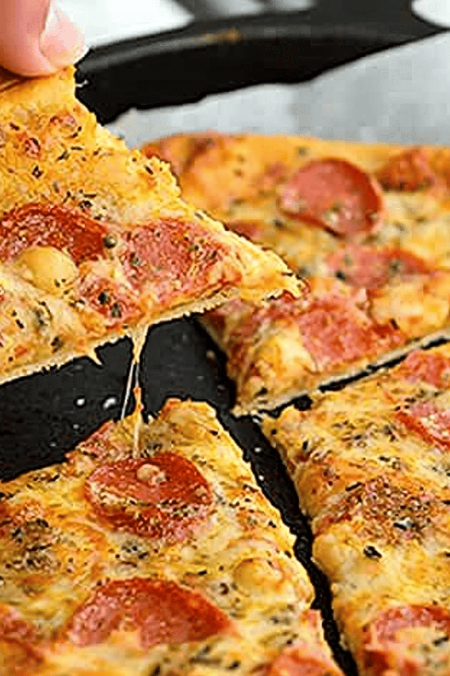 Chickpea Crust Pizza slice on plate showing perfect texture and swirl pattern