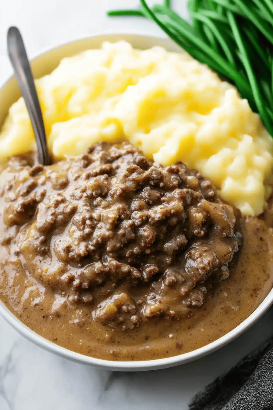 Hamburger Gravy Recipe ingredients organized and measured on kitchen counter