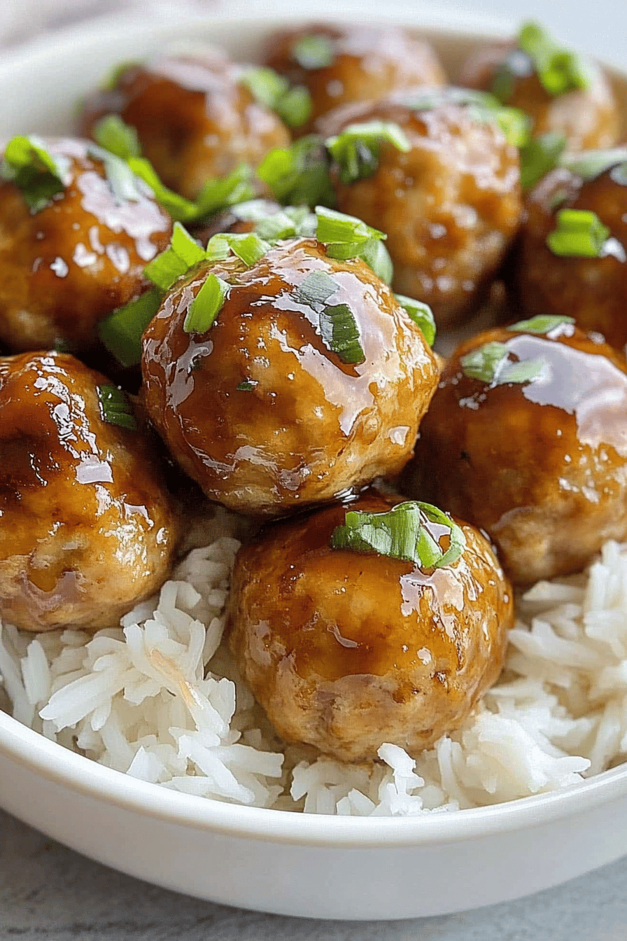 Pineapple Teriyaki Chicken Meatballs slice on plate showing perfect texture and swirl pattern