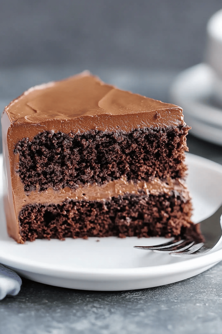 chocolate cake slice on plate showing perfect texture and swirl pattern