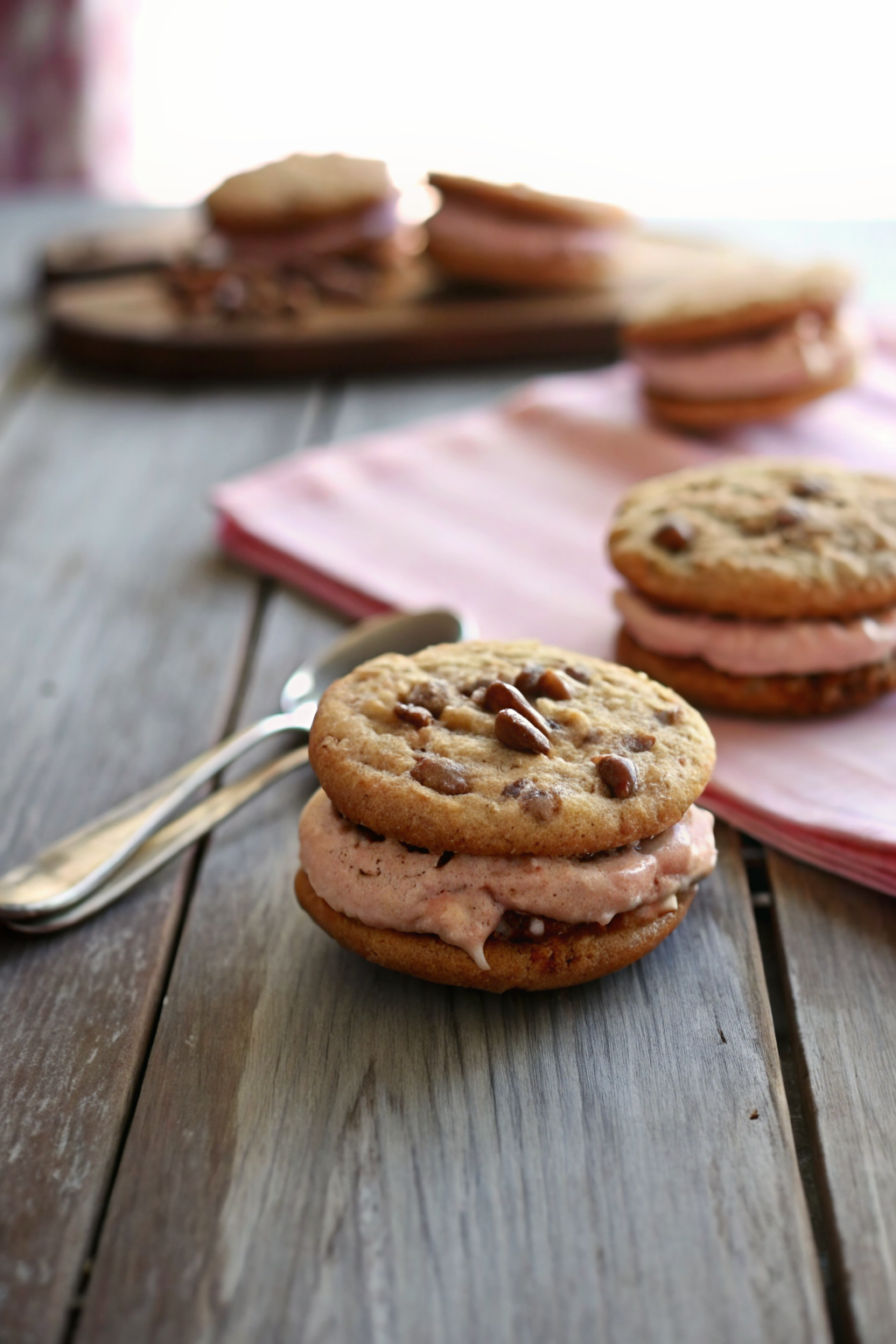 Chocolate Chip Cookie Sandwiches with Nutella Cream Cheese Filling slice on plate showing perfect texture and swirl pattern