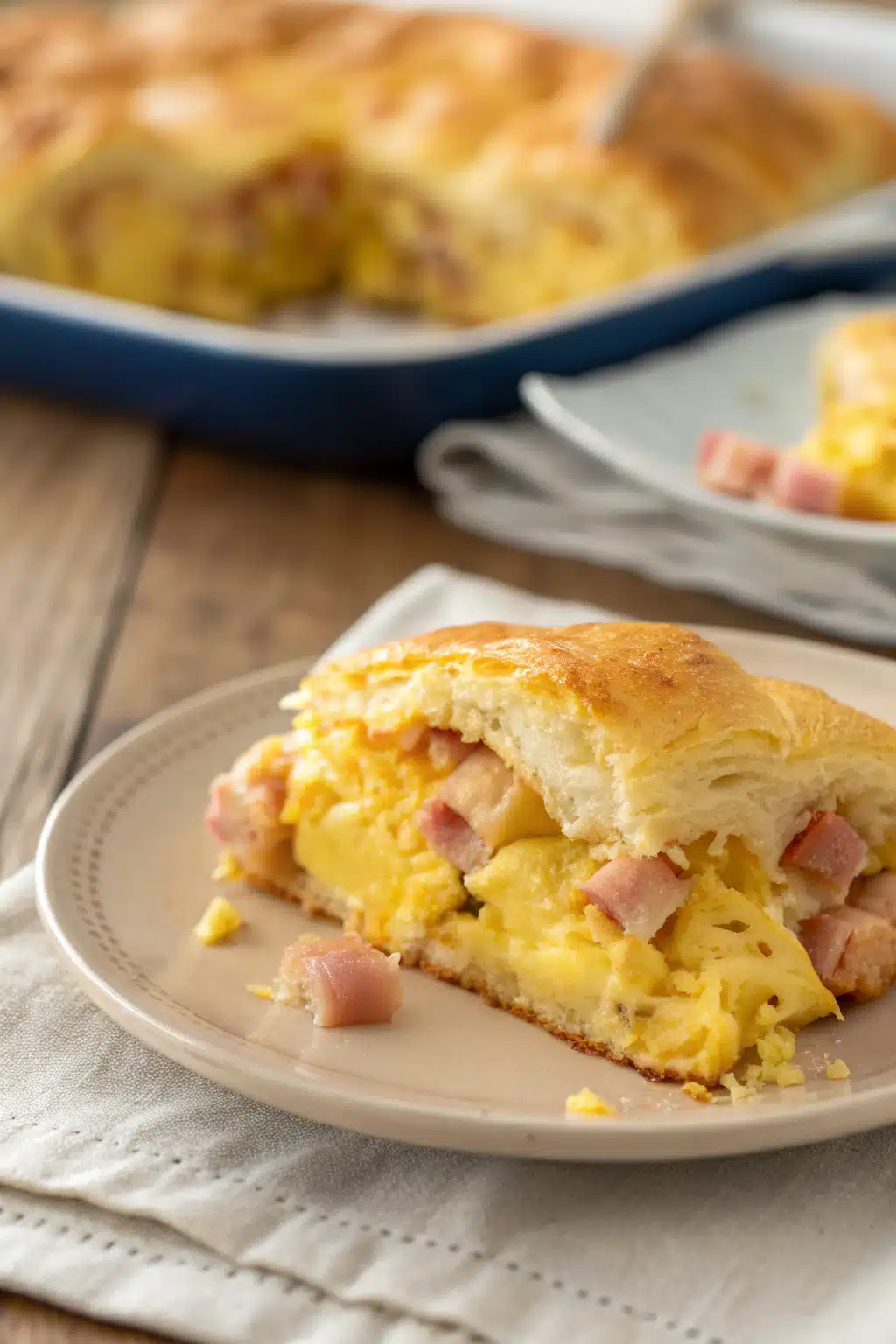 Crescent Roll Breakfast Casserole slice on plate showing perfect texture and swirl pattern